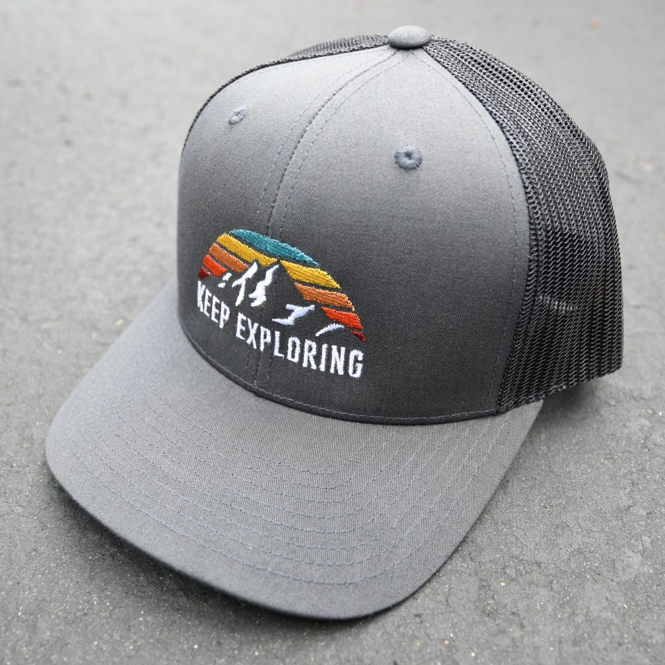 KEEP EXPLORING | CURVED BILL TRUCKER CAP