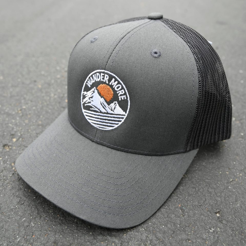 WANDER MORE | CURVED BILL TRUCKER CAP